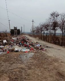 万荣县里望村垃圾遍地影响环境问题的回复 