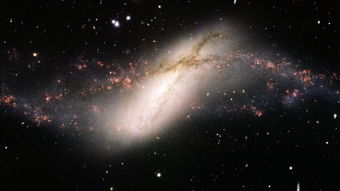 距离地球4200万光年双鱼座星系NGC 660中心沉睡数百万年的黑洞苏醒过来 