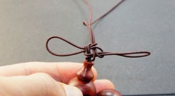 佛珠上的绳子怎么穿怎么打结中国结 
